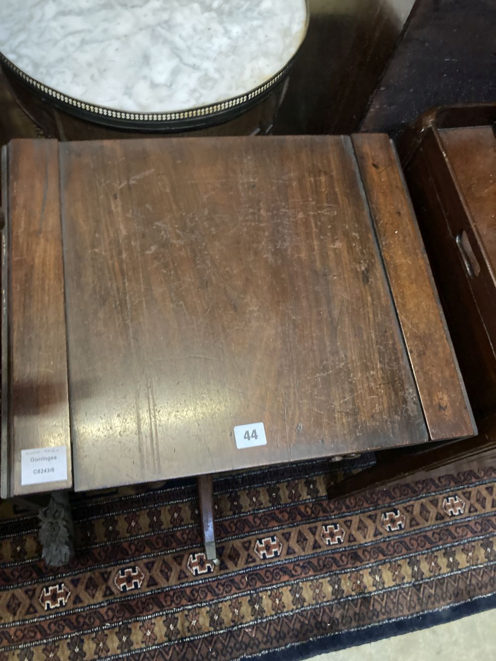 A Regency mahogany drop flap games / writing table, width 50cm depth 40cm height 73cm
